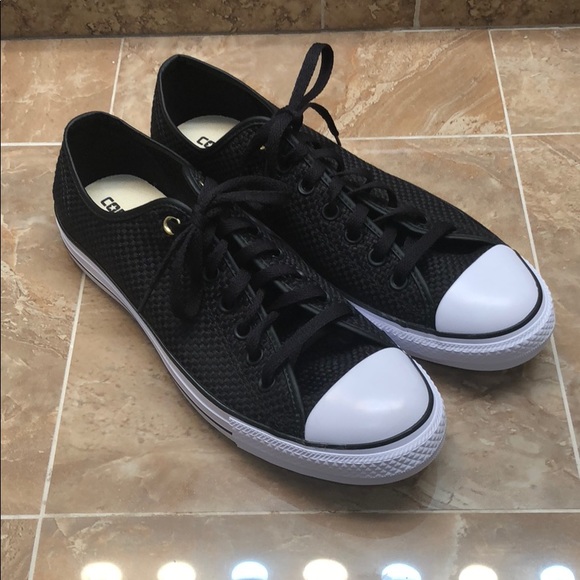 black converse with gold eyelets